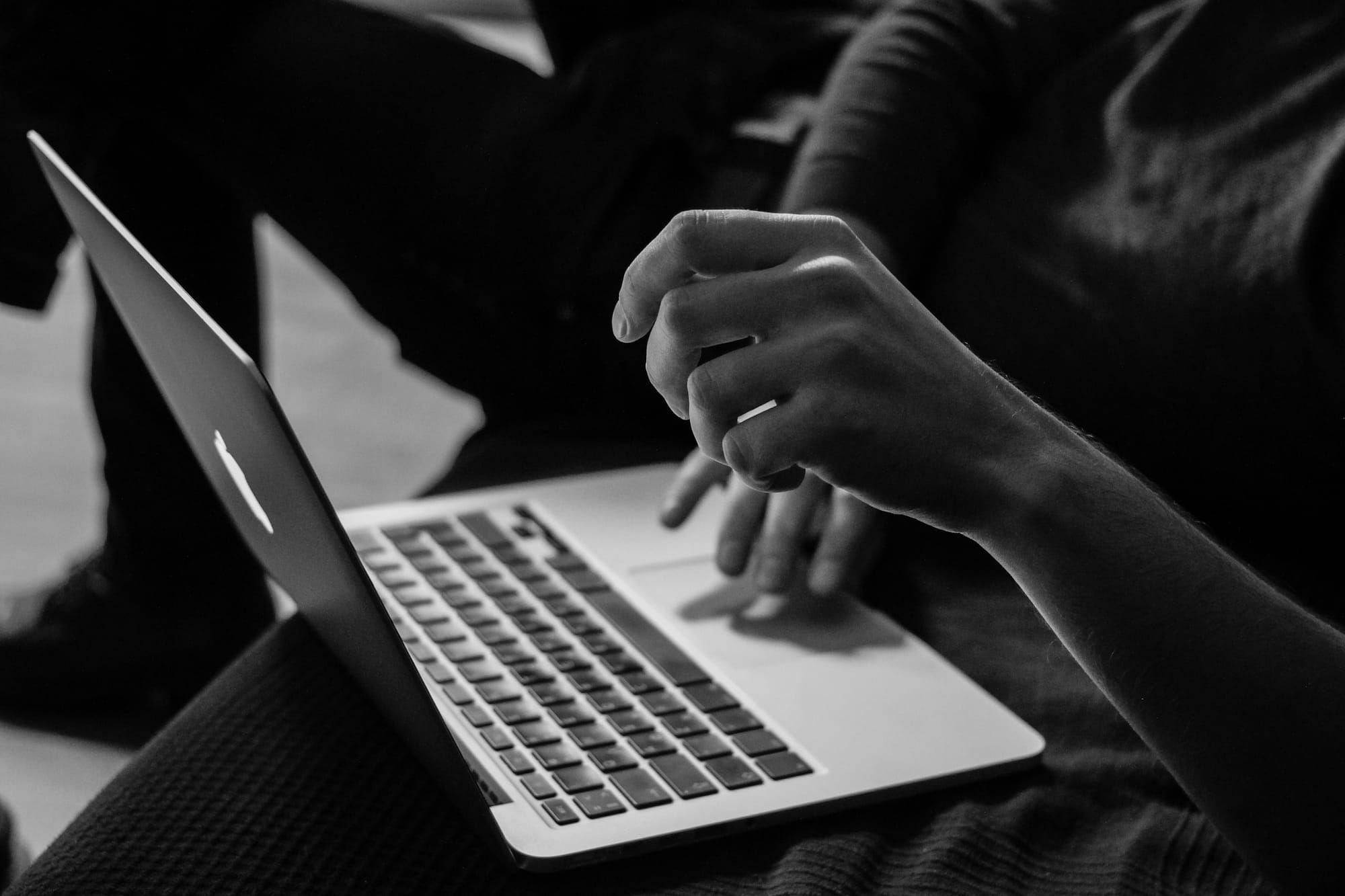 Reviewing a follow-up email draft on a laptop screen