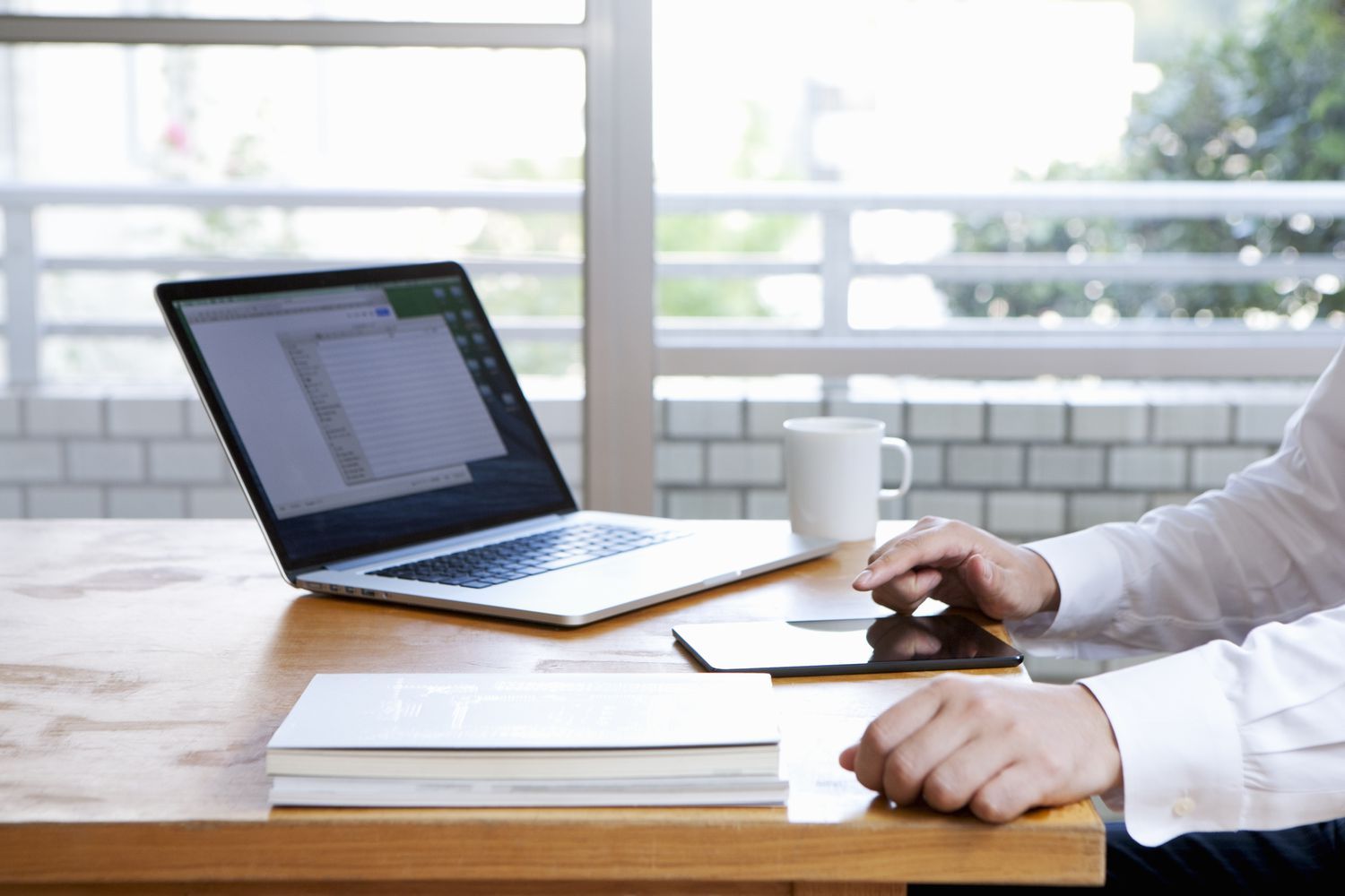 Professional drafting an introduction email template at an office desk