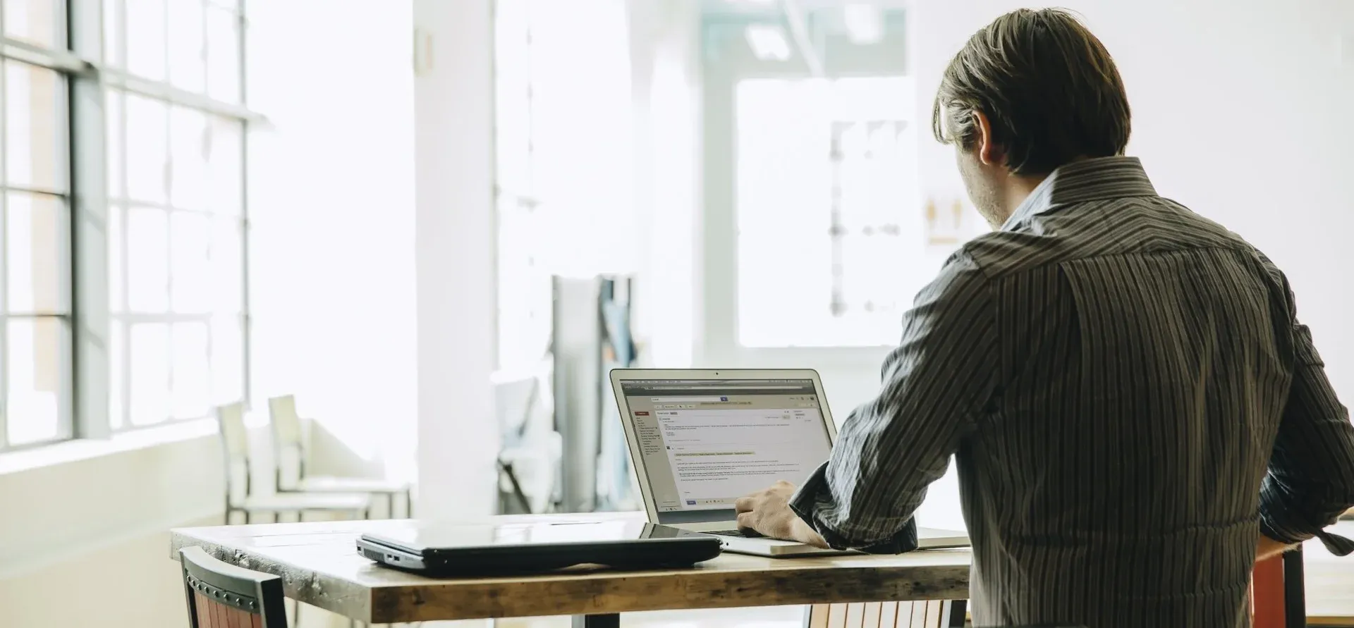 Person reviewing an email address before sending an introduction email
