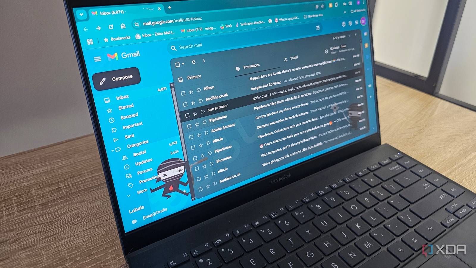 Gmail inbox open on a laptop showing sender names and subject lines