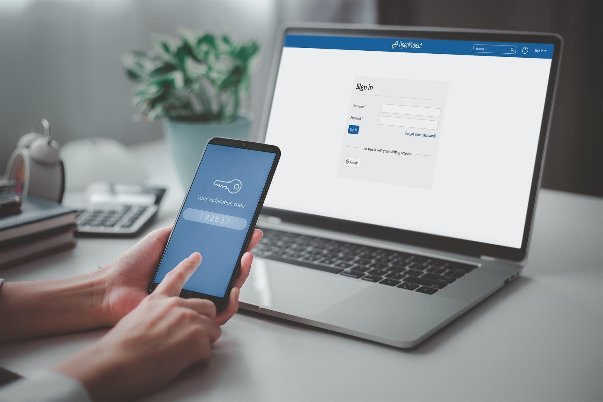 Multi-factor authentication login screen on a laptop and phone